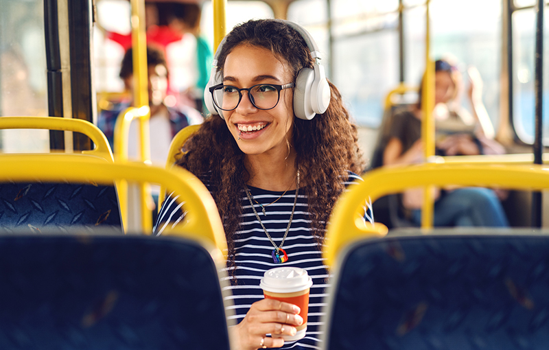 Woman Sitting on the shuttle happily